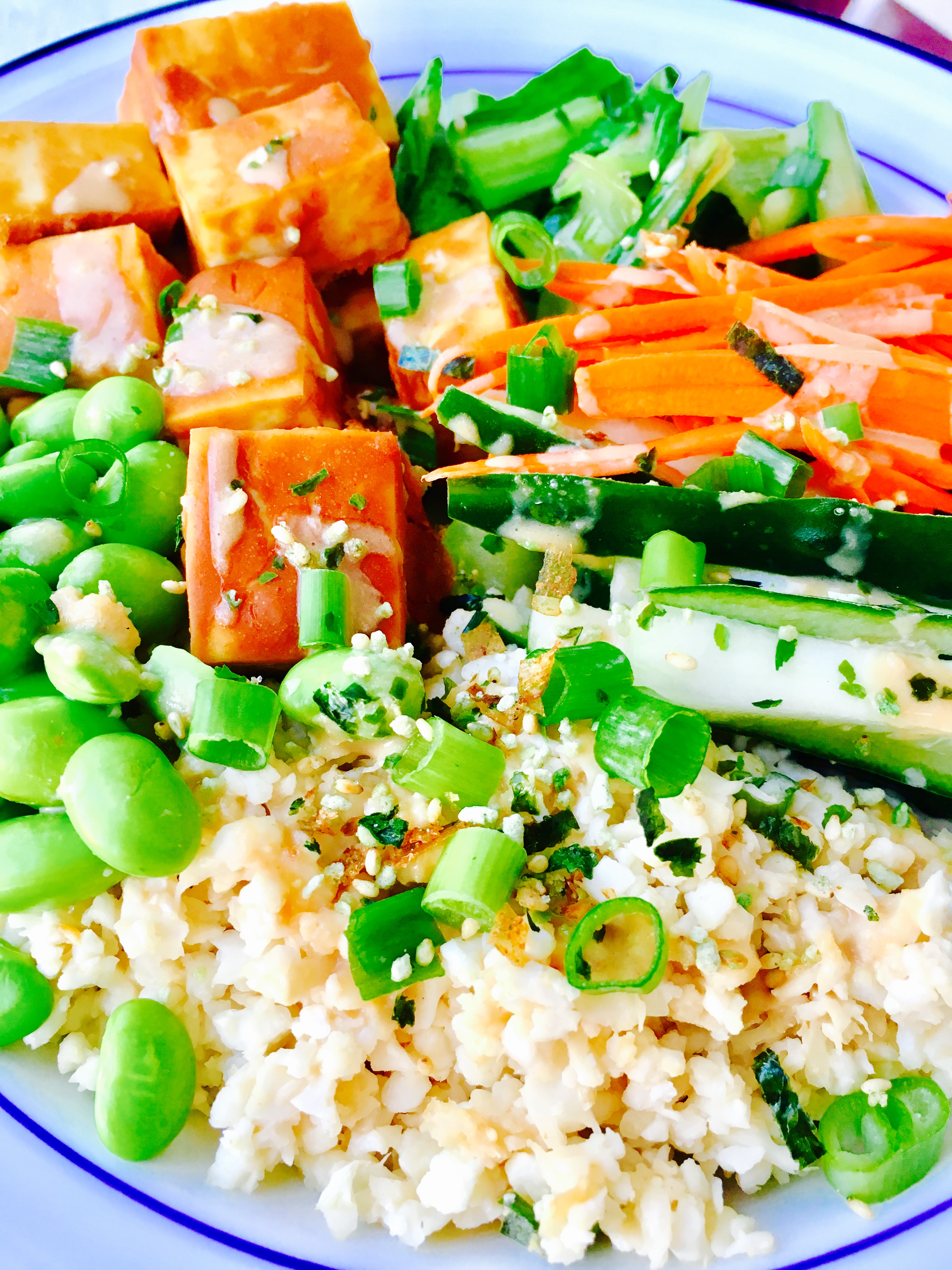 Sriracha Peanut Tofu Power Bowl with Ginger-Tahini Dressing and Cauliflower Rice