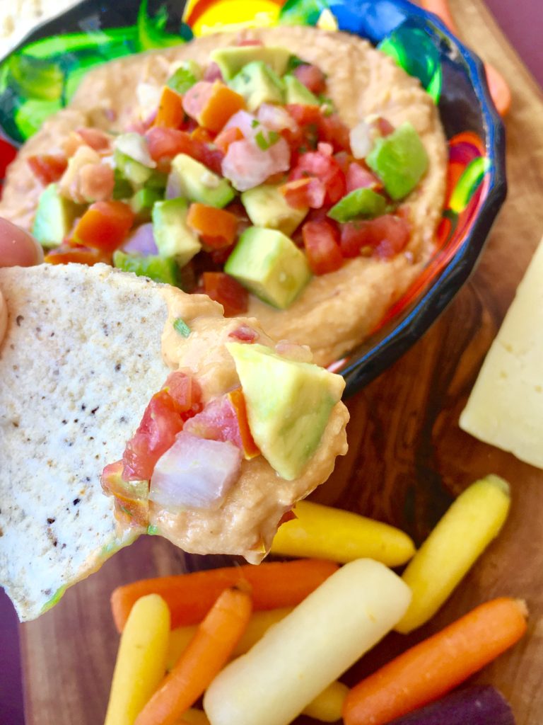 Elevate store bought hummus to another level of delicious with this easy 3-Ingredient Mexican-Style Hummus.  Your seconds from an impressive-looking dip piled with festive toppings.