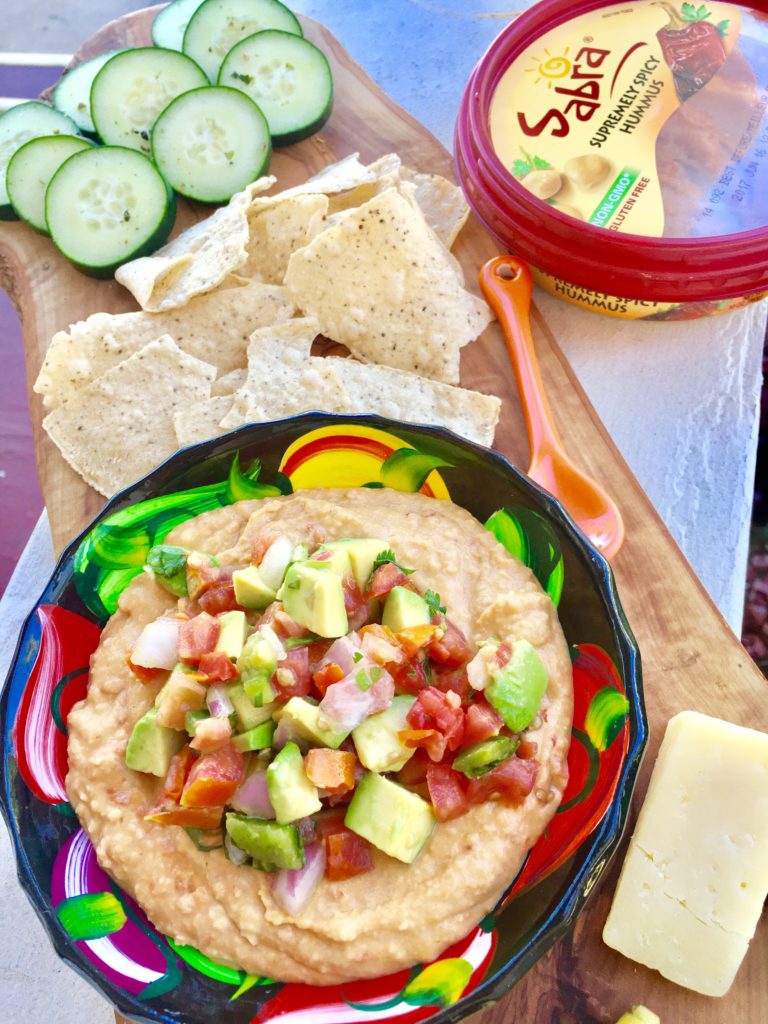 Elevate store bought hummus to another level of delicious with this easy 3-Ingredient Mexican-Style Hummus.  Your seconds from an impressive-looking dip piled with festive toppings.