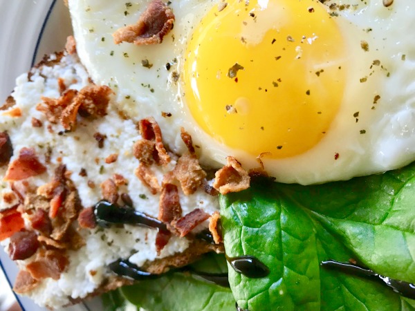 Ricotta toast with bacon sprinkles and #yolkporn